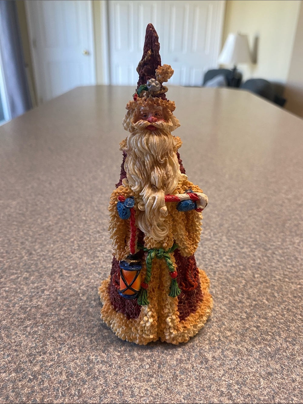 Festive Santa Sculpture in Gold and Burgundy
